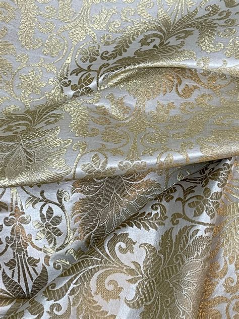 white and gold brocade fabric